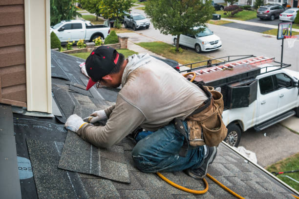 Professional Roof Replacement technician working in Hanlontown, IA